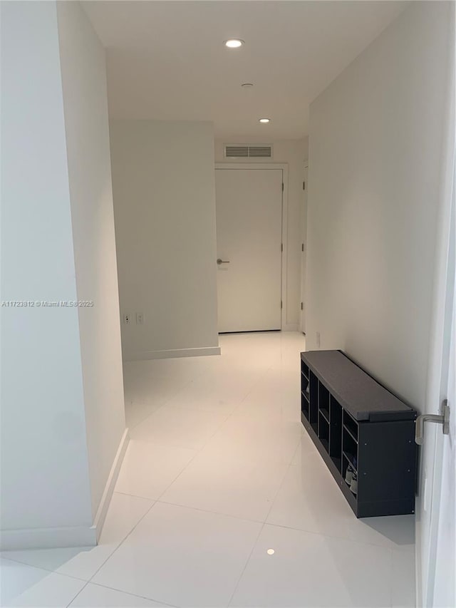 hallway featuring tile patterned flooring