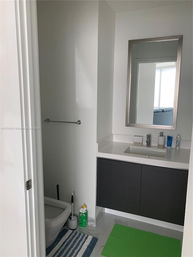 bathroom featuring toilet, tile patterned flooring, and vanity