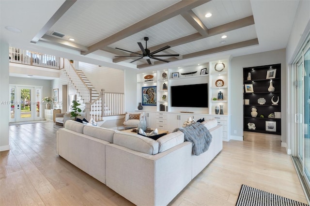 living room featuring ceiling fan, beamed ceiling, light hardwood / wood-style flooring, built in features, and wood ceiling