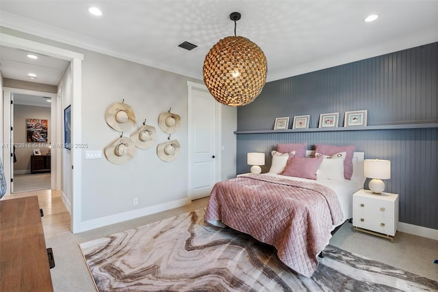 carpeted bedroom featuring crown molding