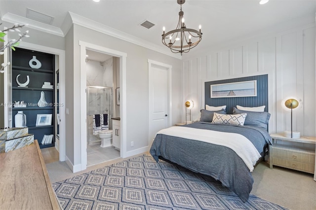 carpeted bedroom featuring a notable chandelier, crown molding, and ensuite bath