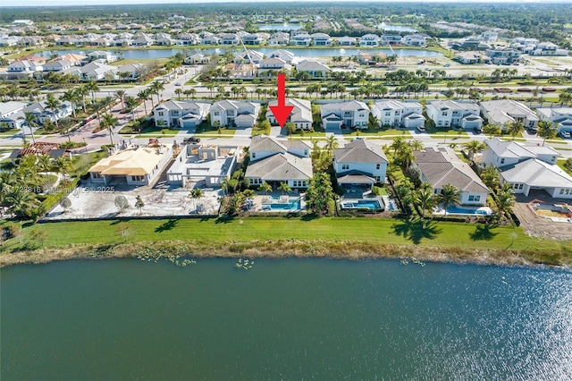 birds eye view of property featuring a water view