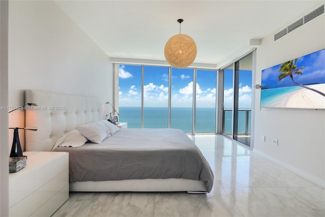 bedroom featuring multiple windows, access to outside, and floor to ceiling windows