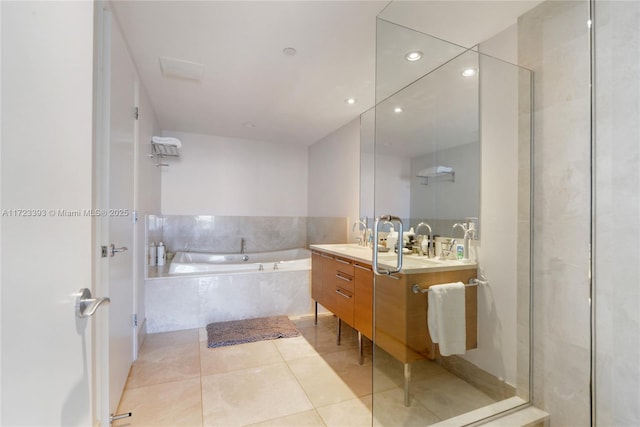 bathroom with tile patterned flooring, vanity, and independent shower and bath