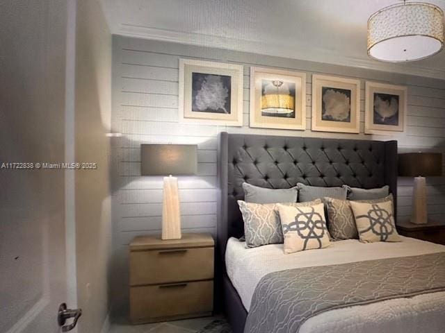 bedroom featuring crown molding