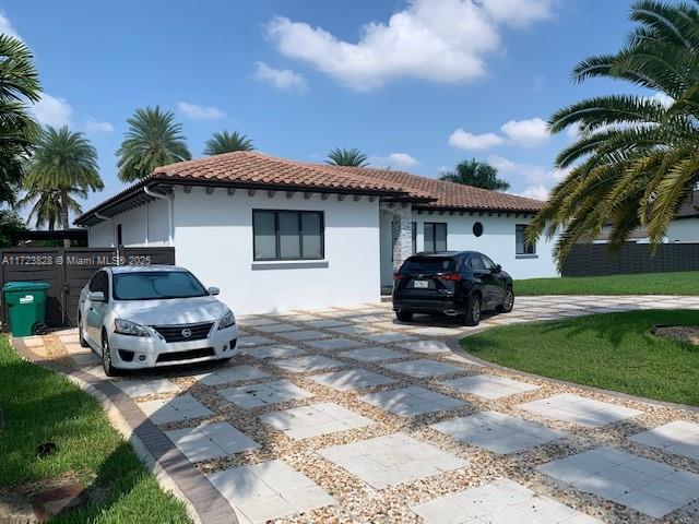 mediterranean / spanish home featuring a front yard