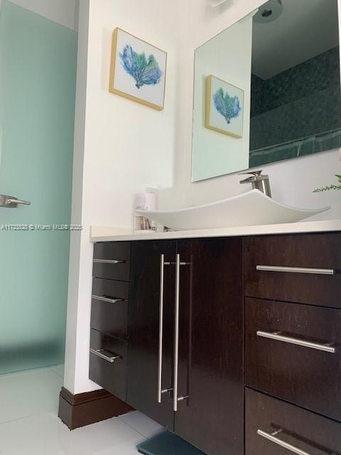 bathroom with vanity and tile patterned floors