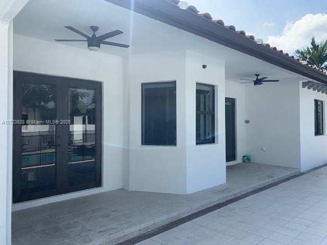 exterior space with ceiling fan, a patio, and french doors