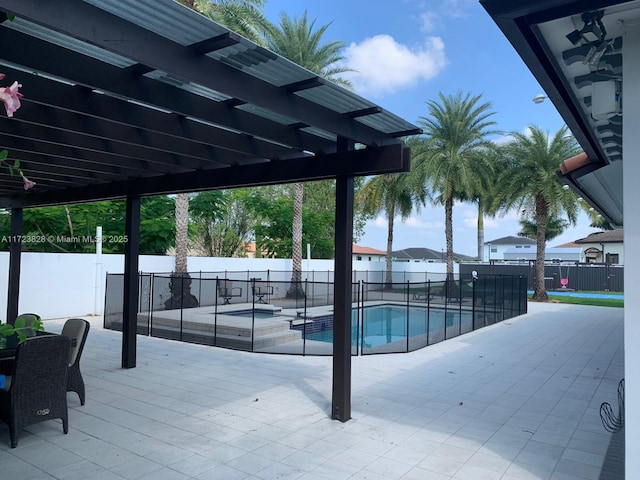 view of pool with a patio area and an in ground hot tub