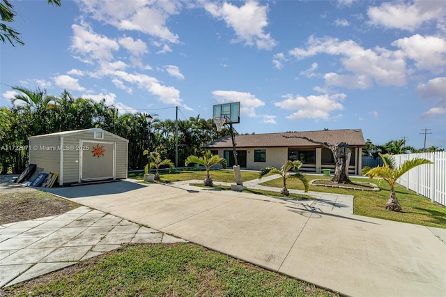 view of front facade featuring a storage unit and a front lawn