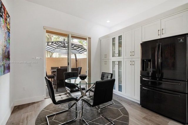 dining space featuring light hardwood / wood-style floors