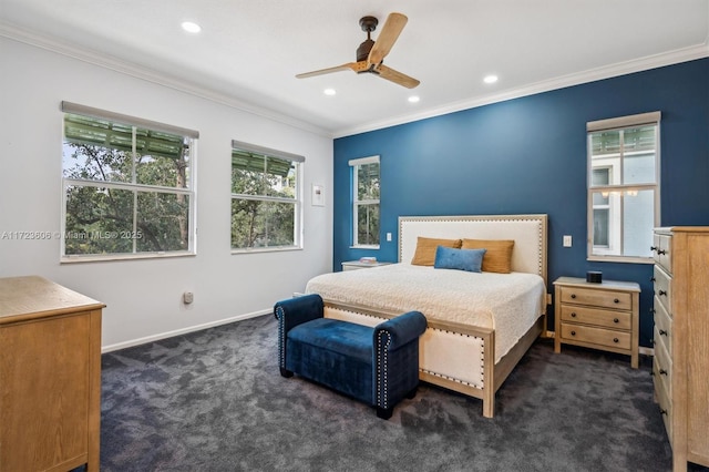 carpeted bedroom with multiple windows, ceiling fan, and crown molding