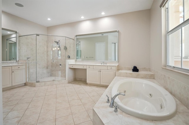 bathroom with tile patterned floors, vanity, and independent shower and bath