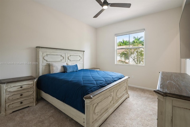 bedroom featuring light colored carpet and ceiling fan