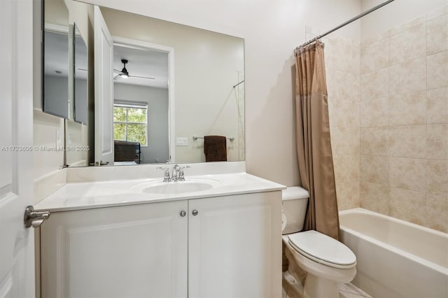 full bathroom featuring ceiling fan, vanity, shower / bath combination with curtain, and toilet