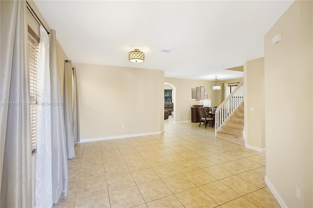 spare room featuring light tile patterned floors