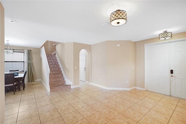 foyer entrance featuring light tile patterned floors