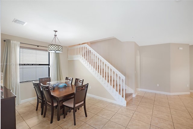 dining space with light tile patterned floors