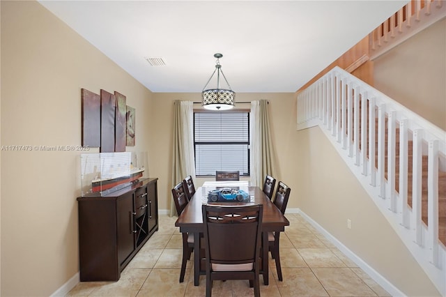 dining area featuring light tile patterned floors