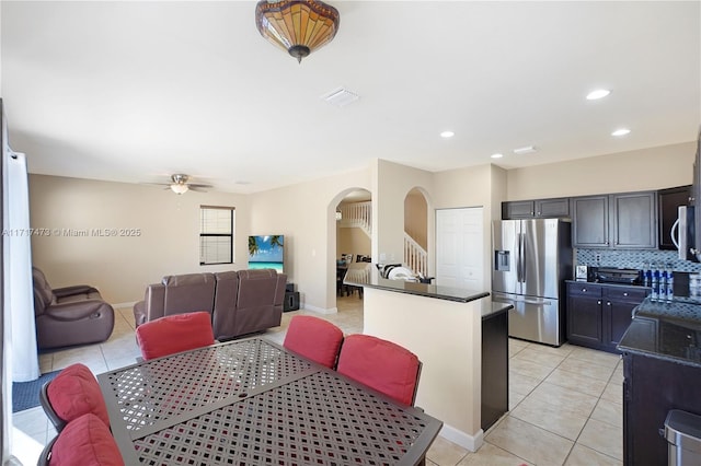 dining area with light tile patterned flooring and ceiling fan