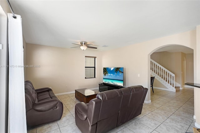 tiled living room featuring ceiling fan