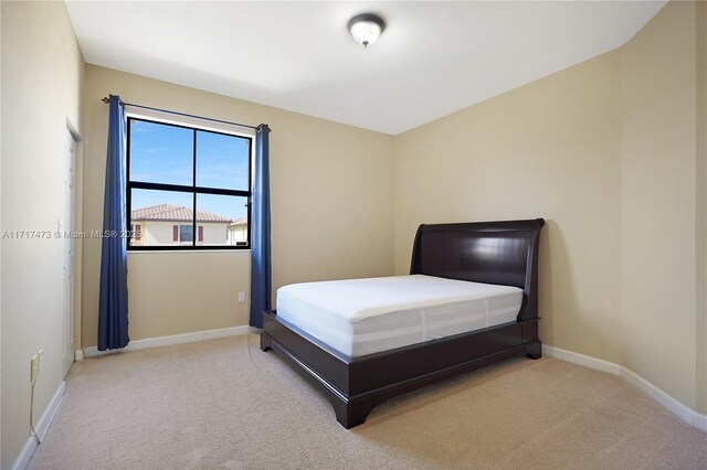 bedroom featuring carpet