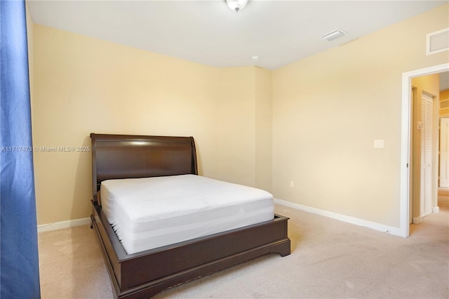 unfurnished bedroom featuring light colored carpet