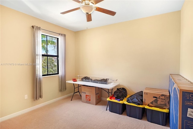 interior space with ceiling fan and carpet