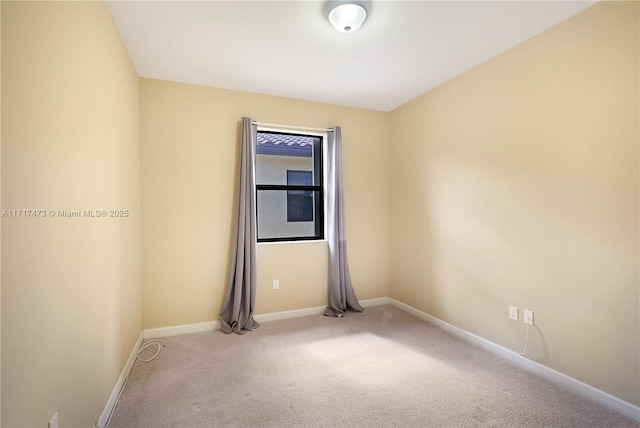 empty room featuring light carpet