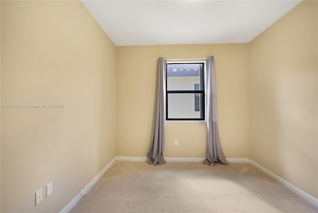 empty room with light colored carpet