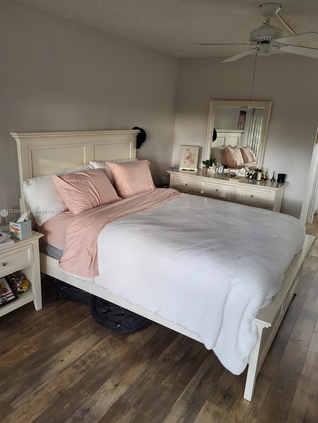 bedroom featuring dark hardwood / wood-style floors and ceiling fan