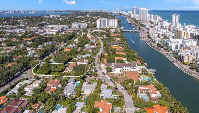 drone / aerial view with a water view