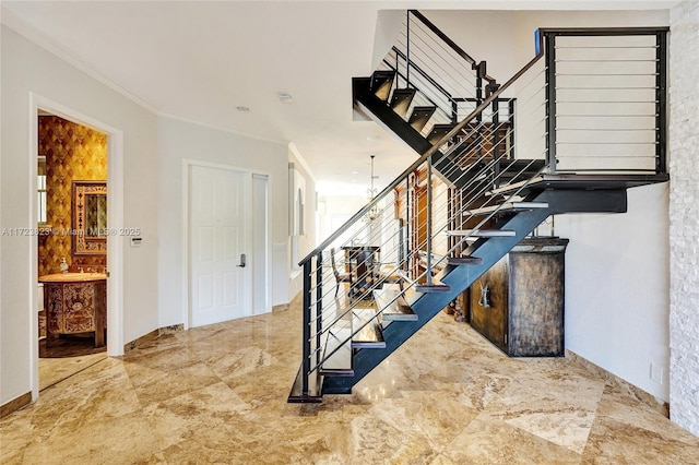 stairway featuring an inviting chandelier and ornamental molding