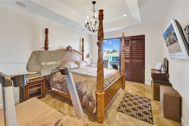 bedroom featuring access to outside, a raised ceiling, ornamental molding, and a notable chandelier