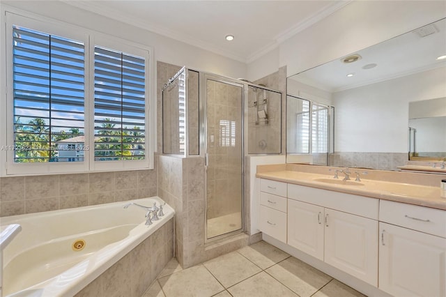 bathroom with tile patterned floors, vanity, a healthy amount of sunlight, and shower with separate bathtub