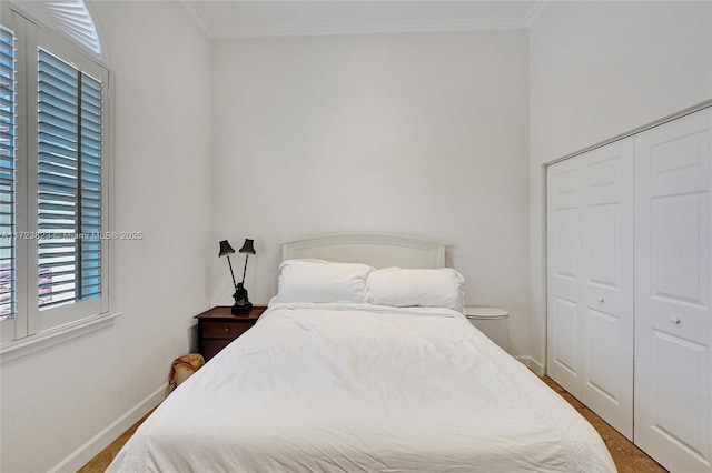 bedroom featuring a closet and ornamental molding