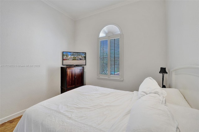 bedroom featuring multiple windows and ornamental molding