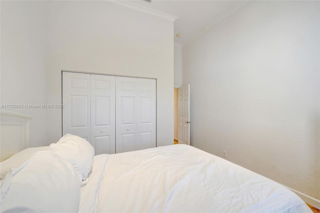 bedroom featuring a closet and ornamental molding