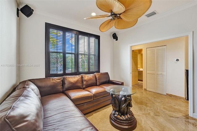 living room with crown molding and ceiling fan