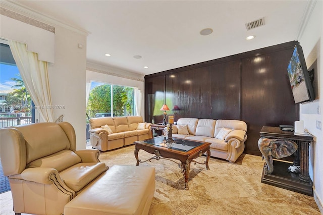 living room with ornamental molding