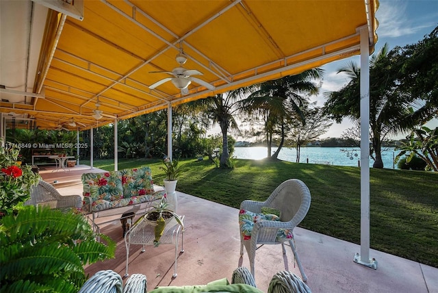 view of patio with an outdoor hangout area, a water view, and ceiling fan