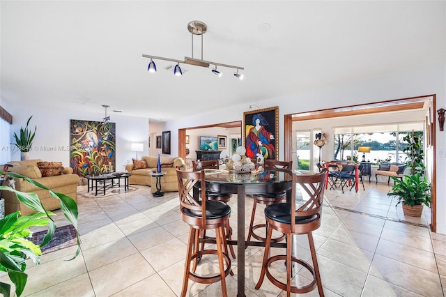 dining space featuring light tile patterned flooring