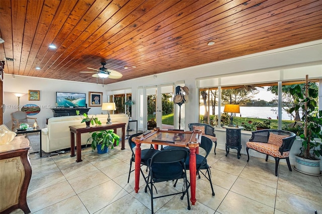 dining area featuring ceiling fan, french doors, wood ceiling, and plenty of natural light