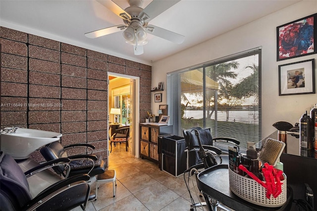 tiled office featuring ceiling fan