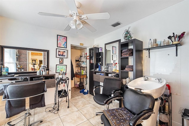 office with ceiling fan and light tile patterned floors