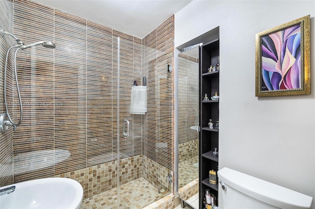 bathroom with toilet, a shower with shower door, and sink