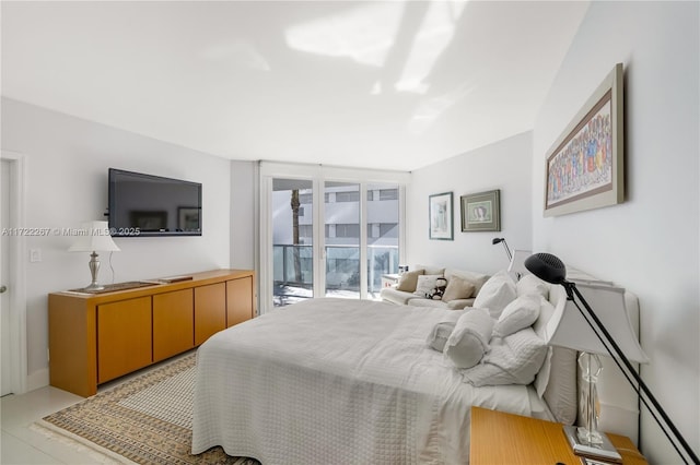 bedroom featuring access to exterior and floor to ceiling windows