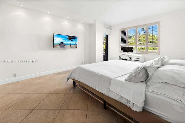 bedroom with light tile patterned floors