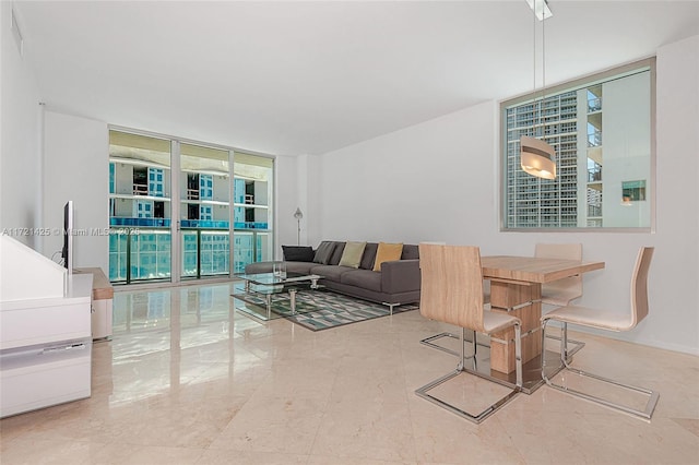 living room featuring floor to ceiling windows