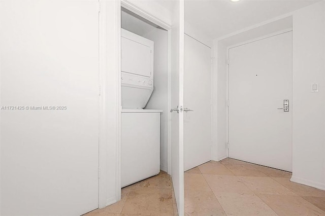55 SE 6th St Unit 1507, Miami, FL 33131 - washroom featuring stacked washer / dryer
